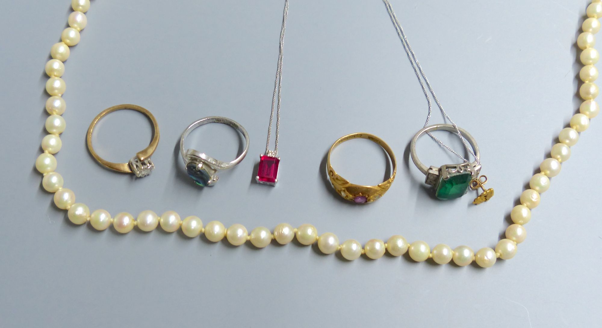 A ruby and diamond dress ring, an illusion set diamond ring and sundry dress rings, etc.